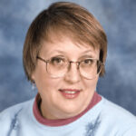 A headshot image of Mary Archer.